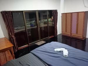 Postel nebo postele na pokoji v ubytování While away วายล์ อะเวย์