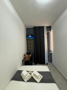 Postel nebo postele na pokoji v ubytování Urban & B