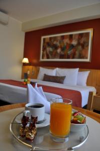 Cama ou camas em um quarto em Qorianka Hotel
