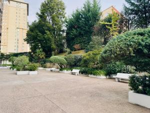 a row of white benches in a park at VIVA VIGO tu escapada perfecta 2 in Vigo