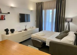 Postel nebo postele na pokoji v ubytování FC Home Suite