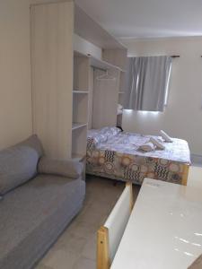 En eller flere senge i et værelse på Apart Punta Iglesia