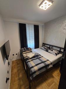 Ένα ή περισσότερα κρεβάτια σε δωμάτιο στο Apartman Mirjana