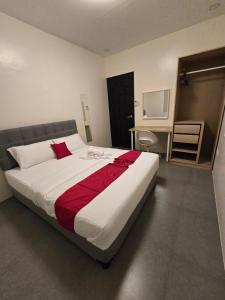 a bedroom with a large bed with a red blanket at Sunny at DJE Villa in Angeles +48 photos