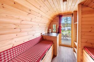 a sauna with a red bench in a log cabin at Camping u Kukačků in Horní Planá