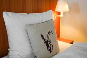 Voodi või voodid majutusasutuse Hotel Pilatus-Kulm toas
