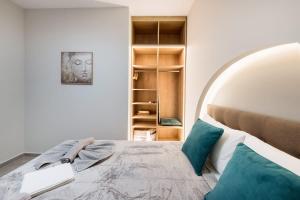 a bedroom with a bed with a laptop on it at Apollon Suite in Thessaloniki