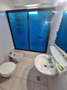 a bathroom with a toilet and a sink at Apartment Chunin Depart in Salta +66 photos