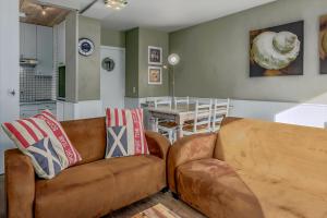 a living room with a couch and a table at Rietpanne Gv06 in Sint-Idesbald