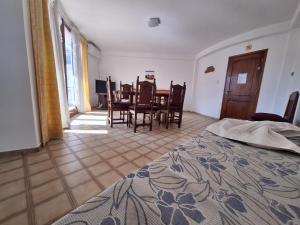 a bedroom with a table and chairs and a dining room at Apartment Chunin Depart in Salta
