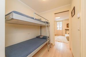 Postel nebo postele na pokoji v ubytování "Vue Du Clocher" - Etroubles Boutique Apartment
