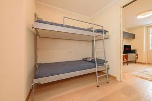 Postel nebo postele na pokoji v ubytování "Vue Du Clocher" - Etroubles Boutique Apartment