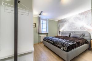 Postel nebo postele na pokoji v ubytování "Vue Du Clocher" - Etroubles Boutique Apartment