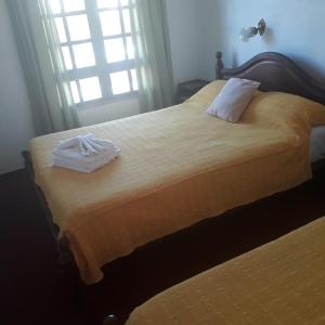 Ένα ή περισσότερα κρεβάτια σε δωμάτιο στο Hotel Andino