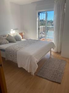 Ένα ή περισσότερα κρεβάτια σε δωμάτιο στο Casa Sylvia