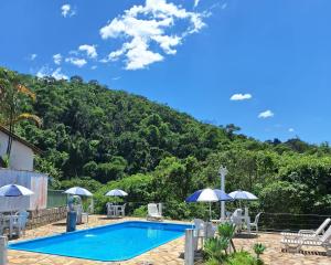 A piscina localizada em Pousada 3 Corações Penedo ou nos arredores