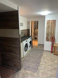 a laundry room with a washing machine in it at Apartment Hearzzeit in Herzberg am Harz