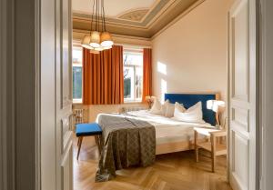 a hotel room with a bed and a window at Wildbad Rothenburg in Rothenburg ob der Tauber +32 photos