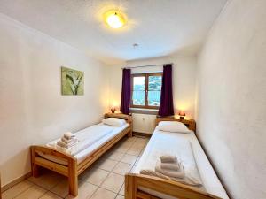 Voodi või voodid majutusasutuse Appartementhaus Königstraße Ferienwohnung Neuschwanstein toas