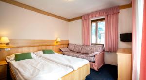 Posteľ alebo postele v izbe v ubytovaní Hotel Al Polo