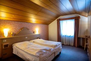 Posteľ alebo postele v izbe v ubytovaní Hotel Al Polo