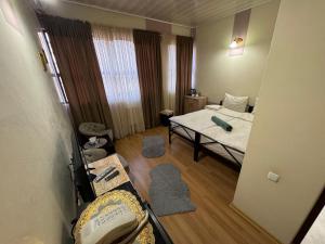 Ένα ή περισσότερα κρεβάτια σε δωμάτιο στο ALEM Hotel