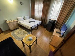 Ένα ή περισσότερα κρεβάτια σε δωμάτιο στο ALEM Hotel