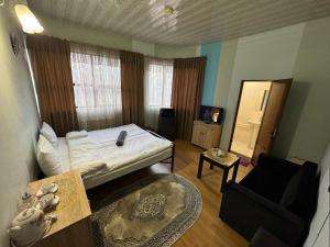 Postel nebo postele na pokoji v ubytování ALEM Hotel