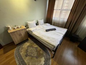 Ένα ή περισσότερα κρεβάτια σε δωμάτιο στο ALEM Hotel