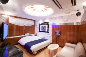 Postel nebo postele na pokoji v ubytování HOTEL & SPA J-MEX Shinjuku Kabukicho (Adult Only)