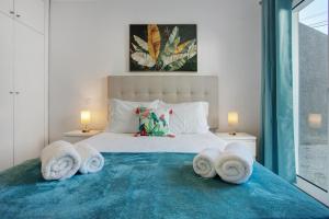 Letto o letti in una camera di Casa Do Tempo com Jacuzzi