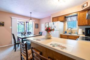 a kitchen with a kitchen island with a counter top at Home Tucked into Towamensing Trails in Albrightsville
