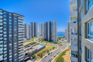an aerial view of a city with tall buildings at Vista Infinita in Concón