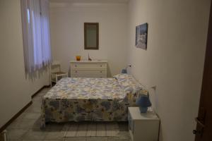 Katil atau katil-katil dalam bilik di Residence Loggetta Margherita