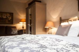 Łóżko lub łóżka w pokoju w obiekcie Apartamenty Za Murem