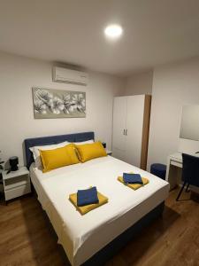 Posteľ alebo postele v izbe v ubytovaní Apartmani Vice