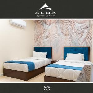 Uma cama ou camas num quarto em Alba pyramids view