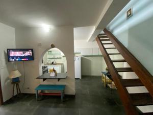 Μια τηλεόραση ή/και κέντρο ψυχαγωγίας στο Aconchego Perto de Tudo