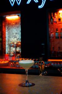 a martini glass sitting on top of a table at Aloft London Excel in London