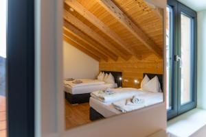 Postel nebo postele na pokoji v ubytování Chalet Reiteralm- mit Sommercard