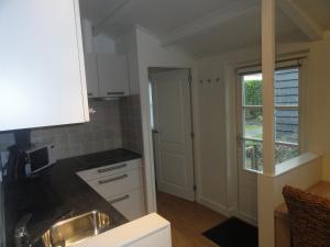 Kuchyň nebo kuchyňský kout v ubytování Luxe Appartement Duinoord + 7 fotografií