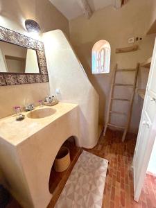 a bathroom with a sink and a mirror at Palais Askar in Essaouira +37 photos