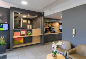 Kuchyň nebo kuchyňský kout v ubytování B&B HOTEL Auxerre Bourgogne