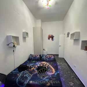 Postel nebo postele na pokoji v ubytování Dimora Sovrana- Gaming Rooms