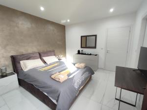 Katil atau katil-katil dalam bilik di Il-Girna- Modern Seaside Accommodation