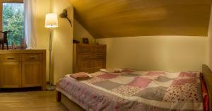 A bed or beds in a room at Vila Studienka