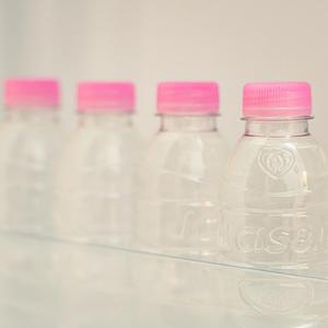 a row of bottles of water in a refrigerator at Noddle Sun Stay in Seoul