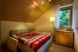 A bed or beds in a room at Vila Studienka