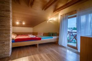 Cama ou camas em um quarto em Vila Studienka