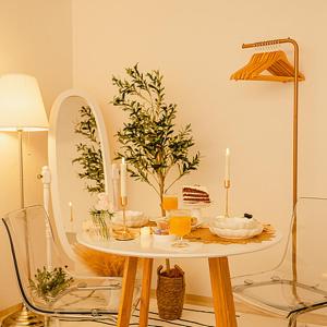 a table with a mirror and a table with candles on it at Noddle Sun Stay in Seoul